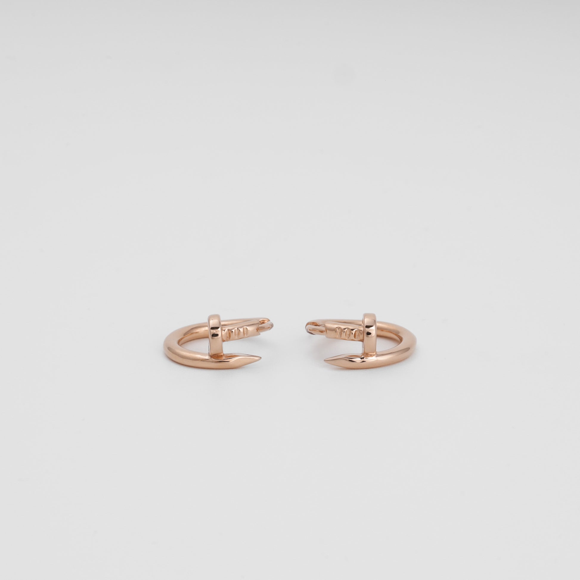 14K rose gold huggie hoop close-up smooth surface — Kabluchka
