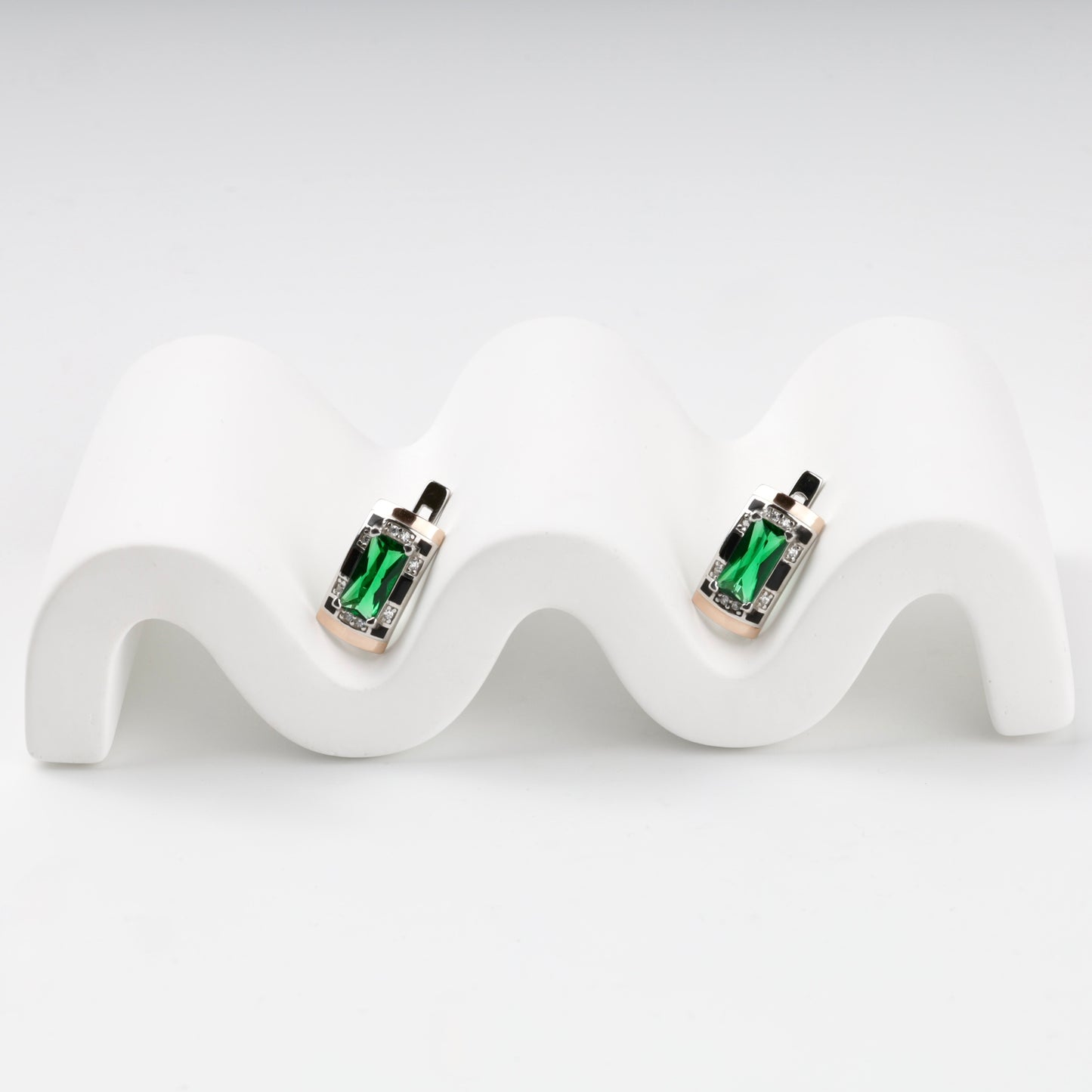 Silver and Gold 375 green alpinite earrings, angled view
