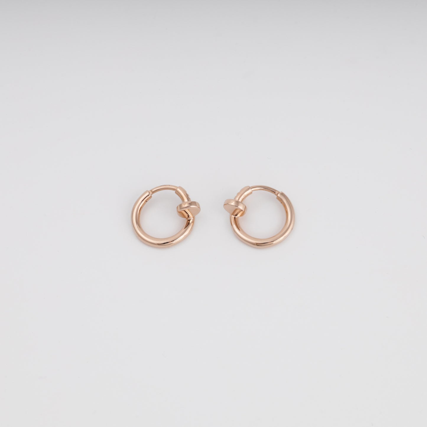Minimalist rose gold huggie earrings side profile view — Kabluchka