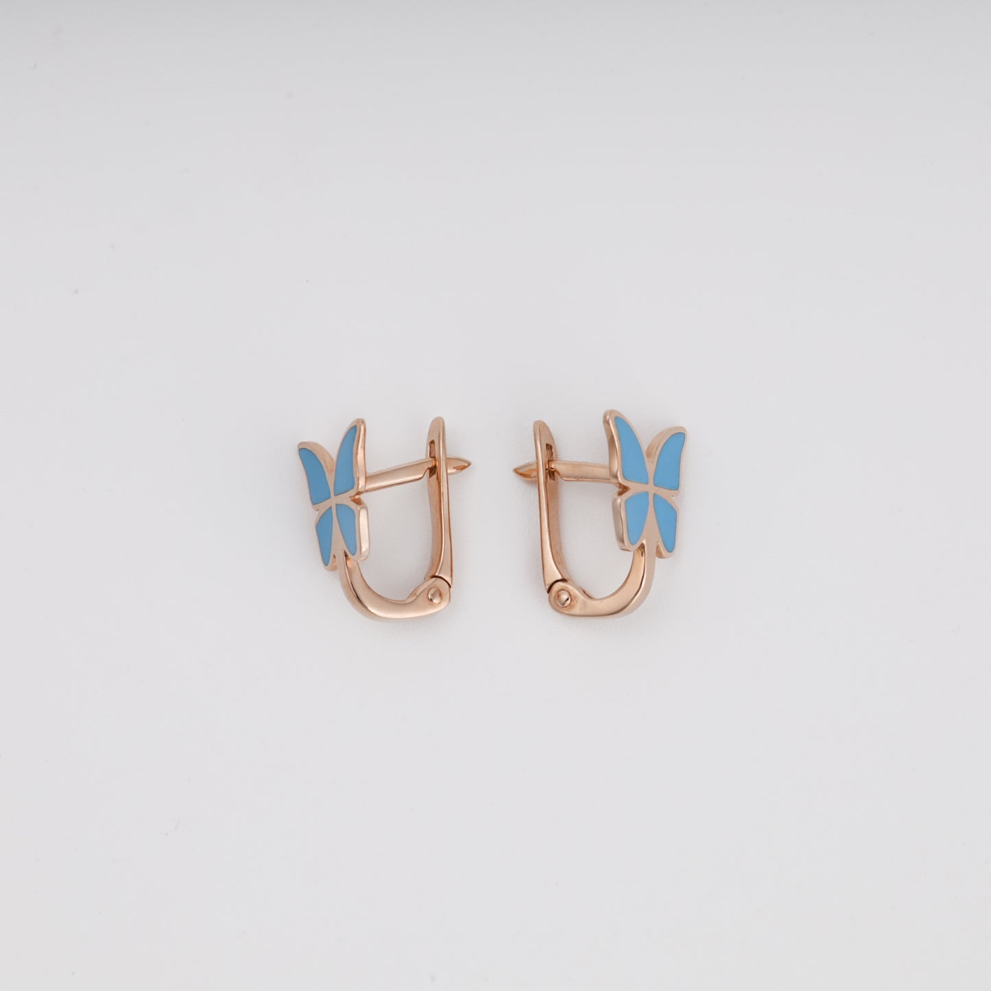 Blue enamel butterfly earrings pair on display — Ukrainian gold jewelry