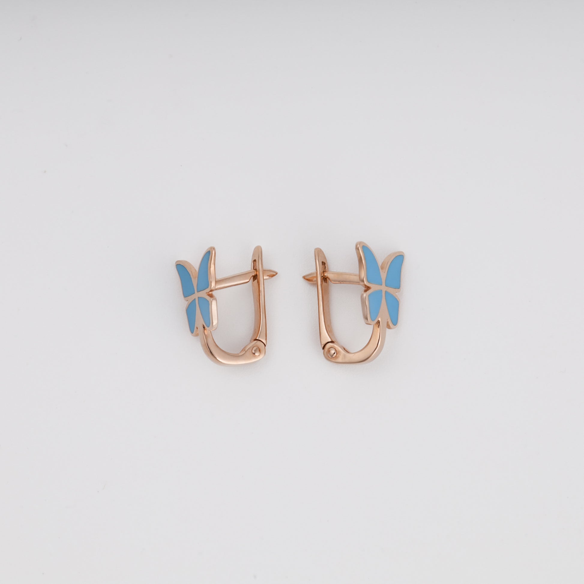 Blue enamel butterfly earrings pair on display — Ukrainian gold jewelry