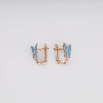Blue enamel butterfly earrings pair on display — Ukrainian gold jewelry