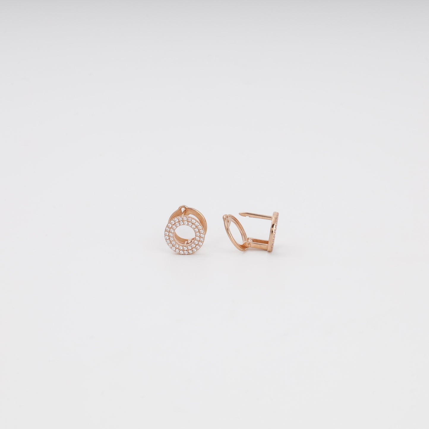 Rose gold pavé earrings detail — sparkling cubic zirconia in concentric rows