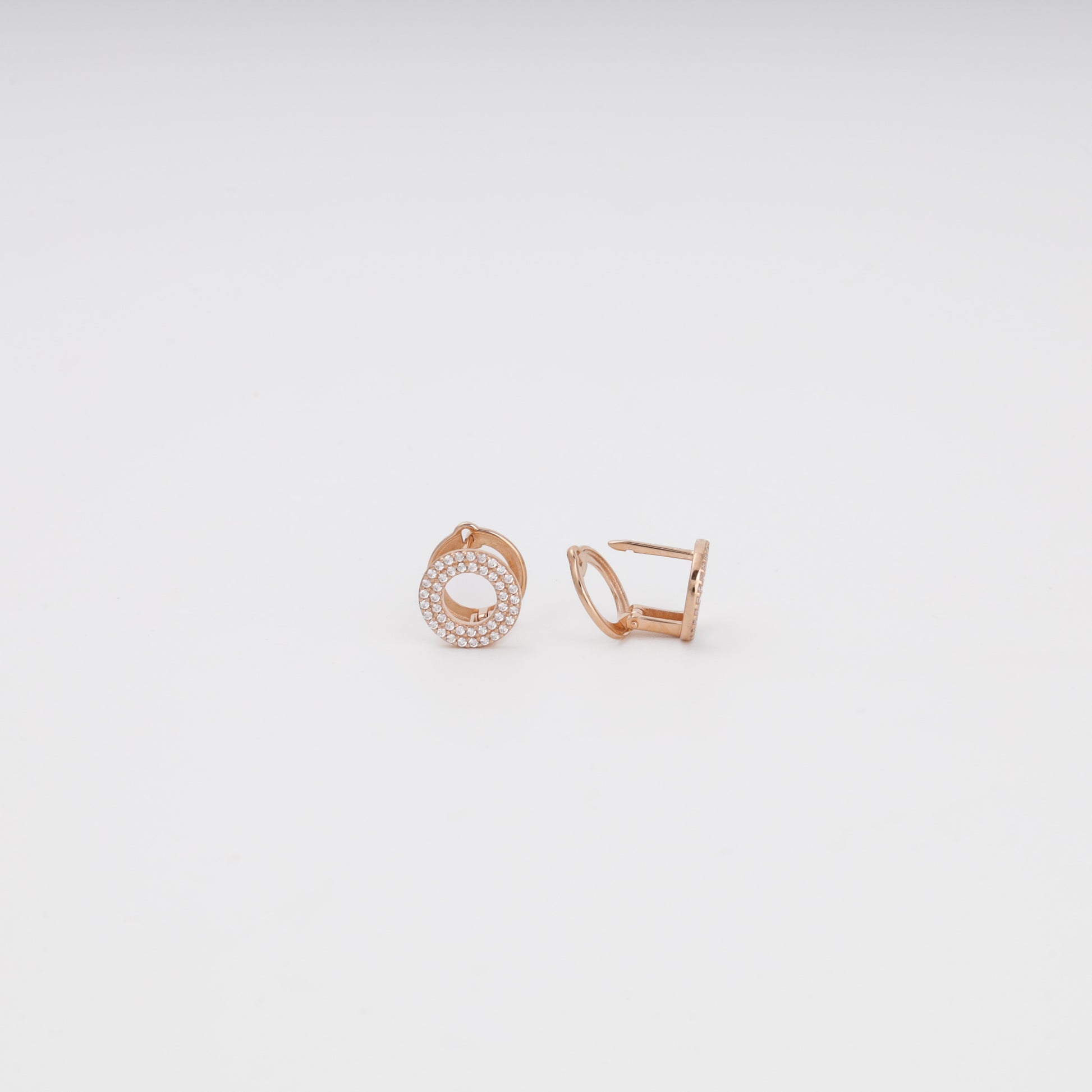 Rose gold pavé earrings detail — sparkling cubic zirconia in concentric rows