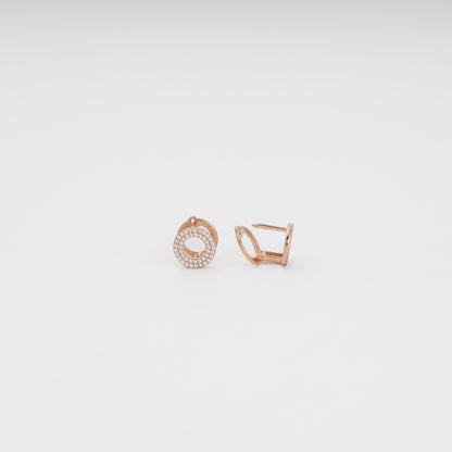 Rose gold pavé earrings detail — sparkling cubic zirconia in concentric rows