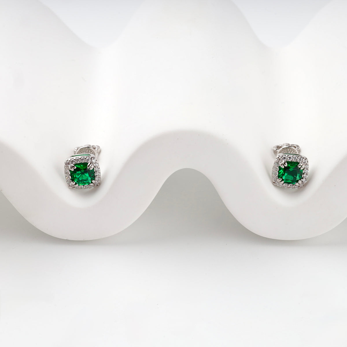 Silver 925 green cubic zirconia halo earring, profile view
