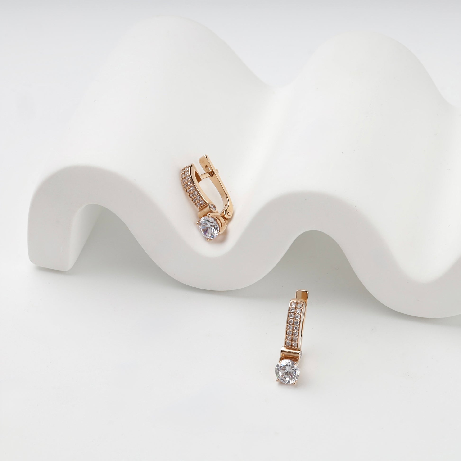 Cubic zirconia drop earrings with English locks, product view — Kabluchka