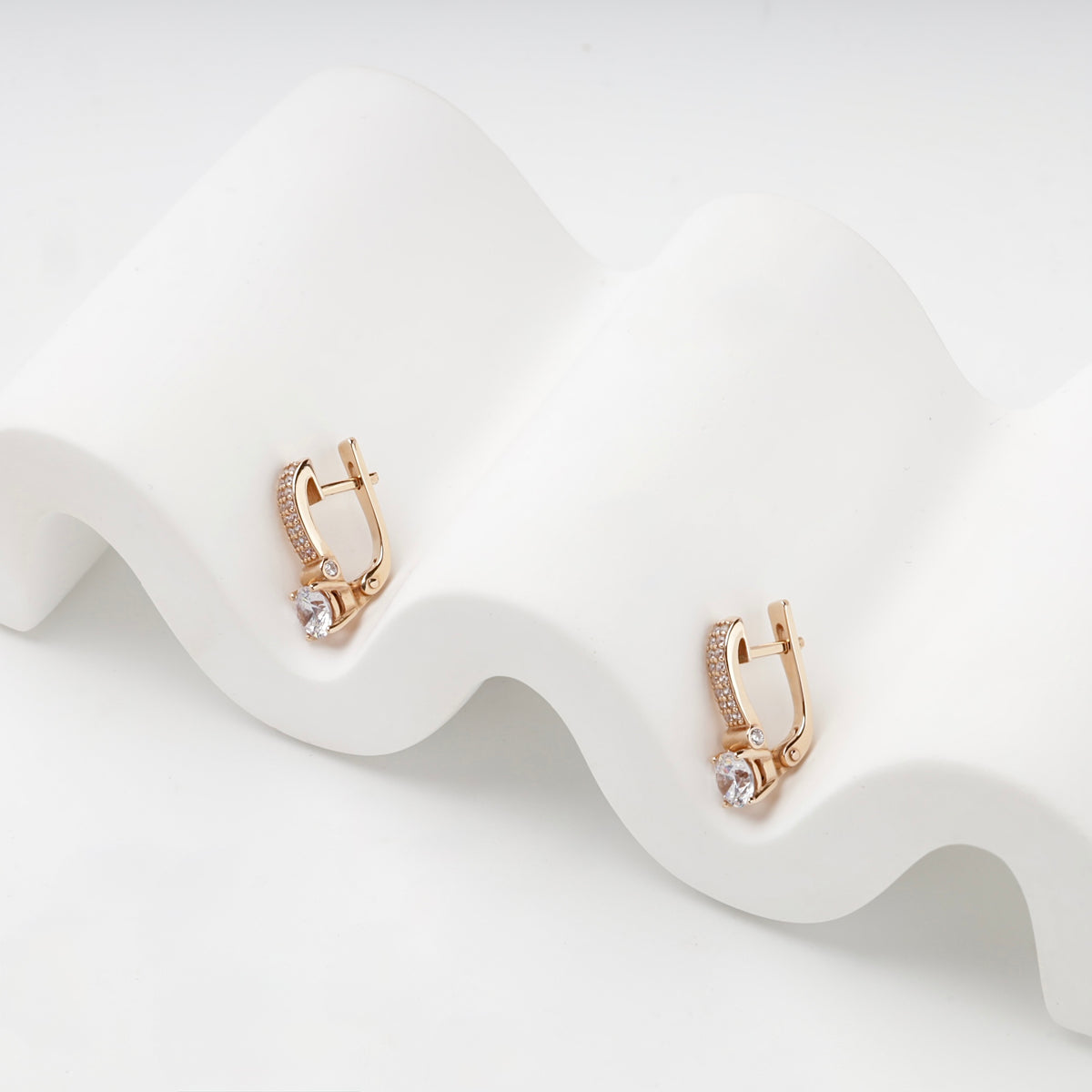 Rose gold and cubic zirconia earrings, side view — Kabluchka