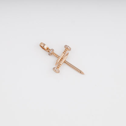 Nail cross pendant side angle showing rose gold craftsmanship