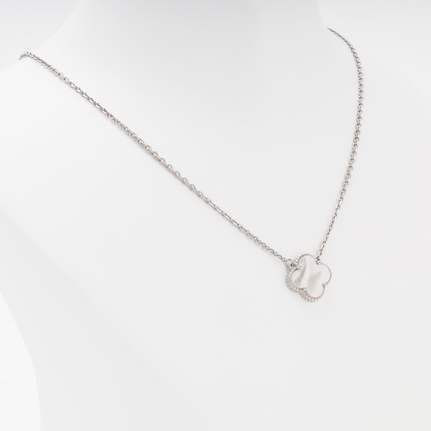 Silver clover pendant necklace close up angled — Kabluchka
