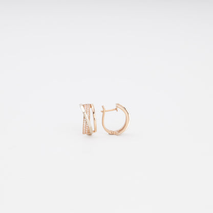 Gold 585 Crossover Huggie Earrings on Surface — Kabluchka