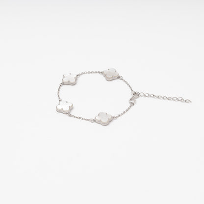 Silver 925 station bracelet with mother-of-pearl clover charms flat lay — Kabluchka