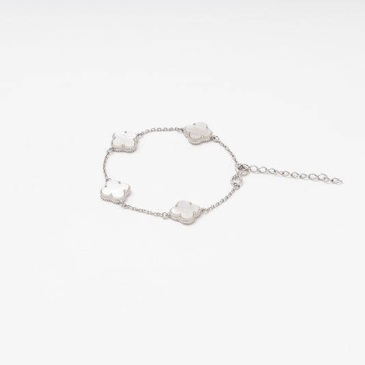 Silver 925 station bracelet with mother-of-pearl clover charms flat lay — Kabluchka
