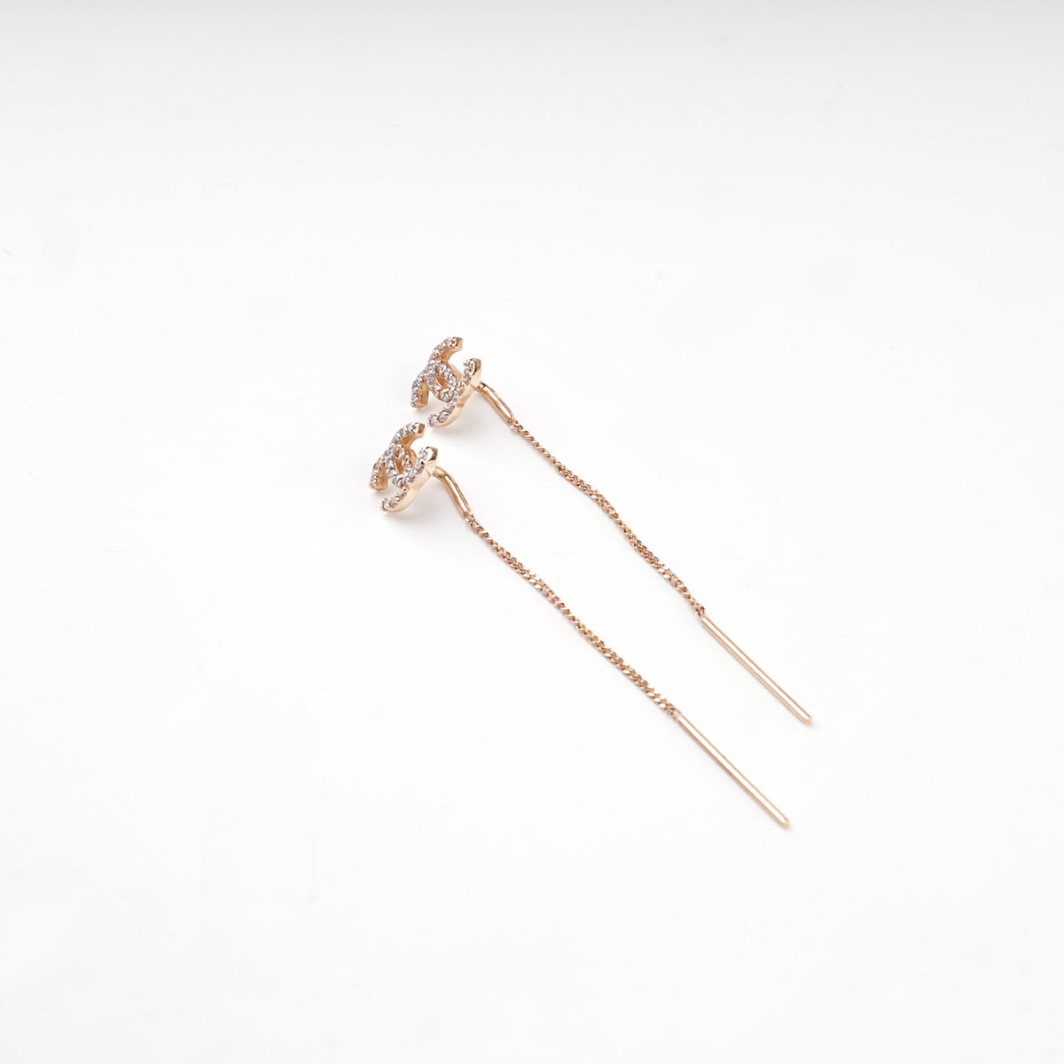 Rose gold 585 clear-stone threader earrings — angled view — Kabluchka