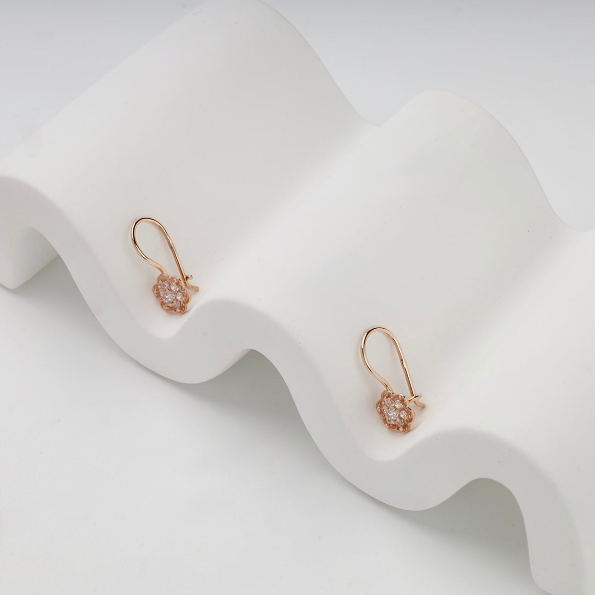 Rose Gold 14K floral kids earrings, angled display view