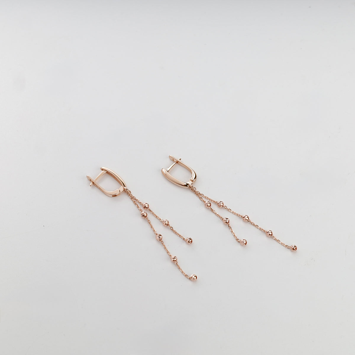 Rose gold 585 beaded chain drop earrings, close pair view