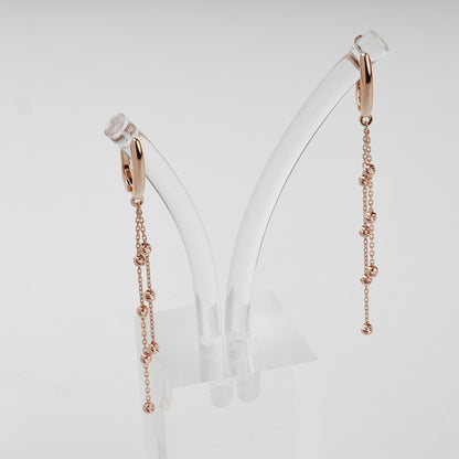 Rose gold 585 beaded chain drop earrings on display stand