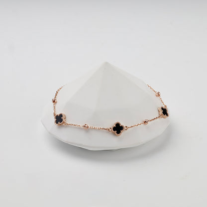 Rose gold 585 black onyx clover bracelet, styled front view