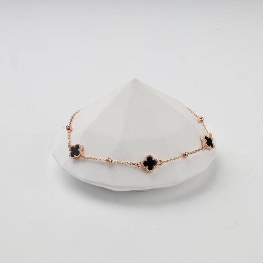 Rose gold 585 black onyx clover bracelet, styled front view