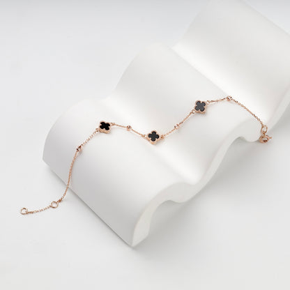 Rose gold 585 black onyx clover bracelet, angled full view