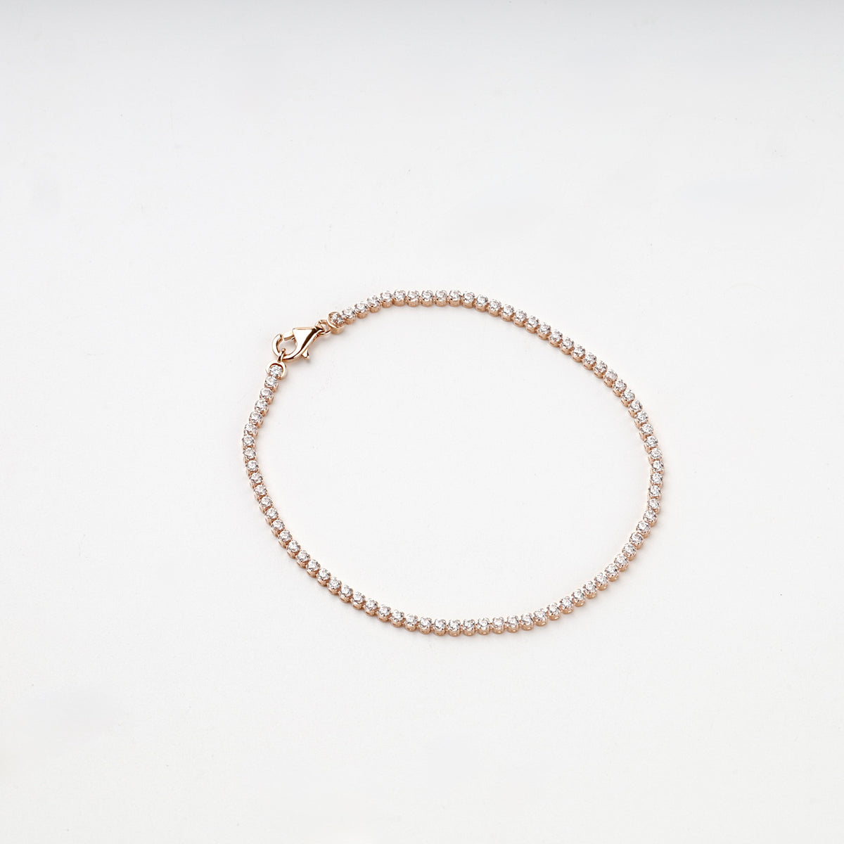 Rose gold tennis bracelet circular arrangement