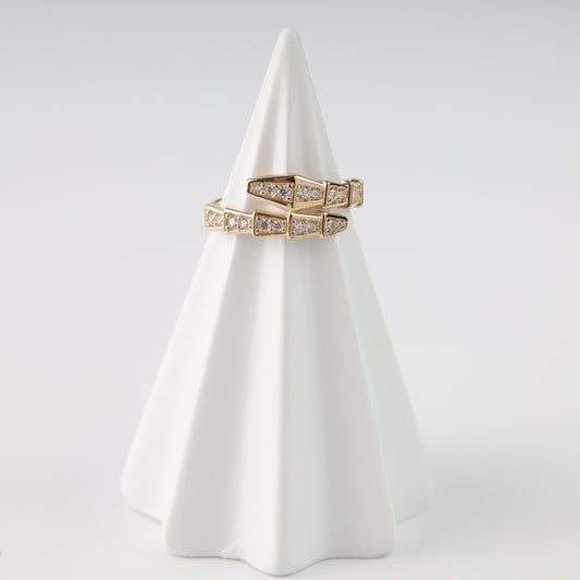 An elegant 14K Rose Gold ring shaped like a coiled snake with shimmering  inserts.