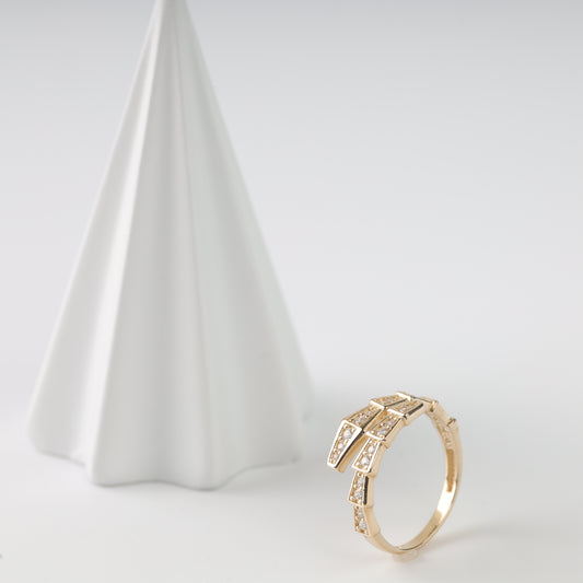 An elegant 14K Rose Gold ring shaped like a coiled snake with shimmering  inserts.