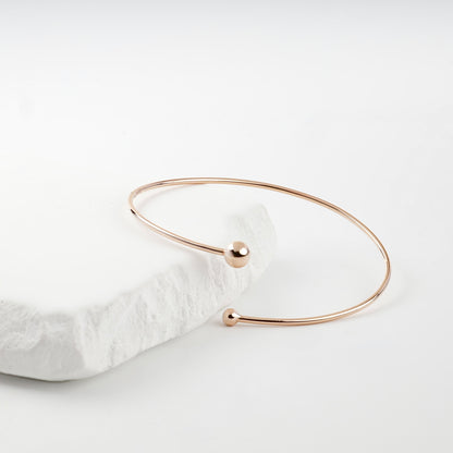 Rose gold open bracelet smaller ball detail measured by caliper