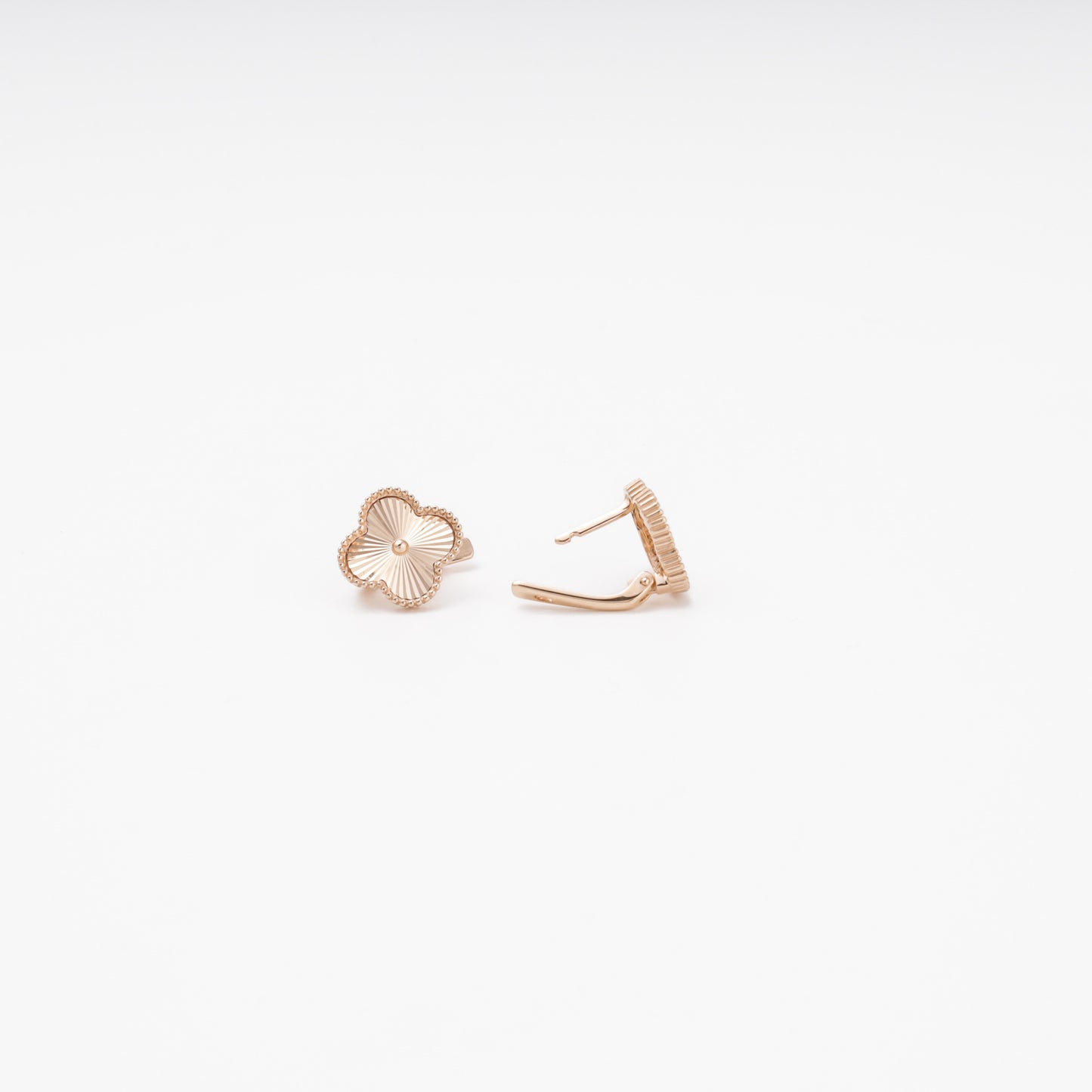 Rose gold clover stud earrings side profile view — Kabluchka