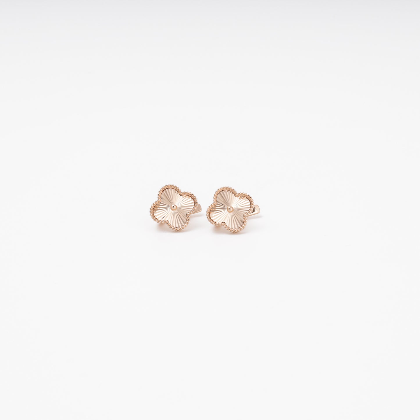 Rose gold 14K clover earrings with diamond-cut texture, pair view — Kabluchka