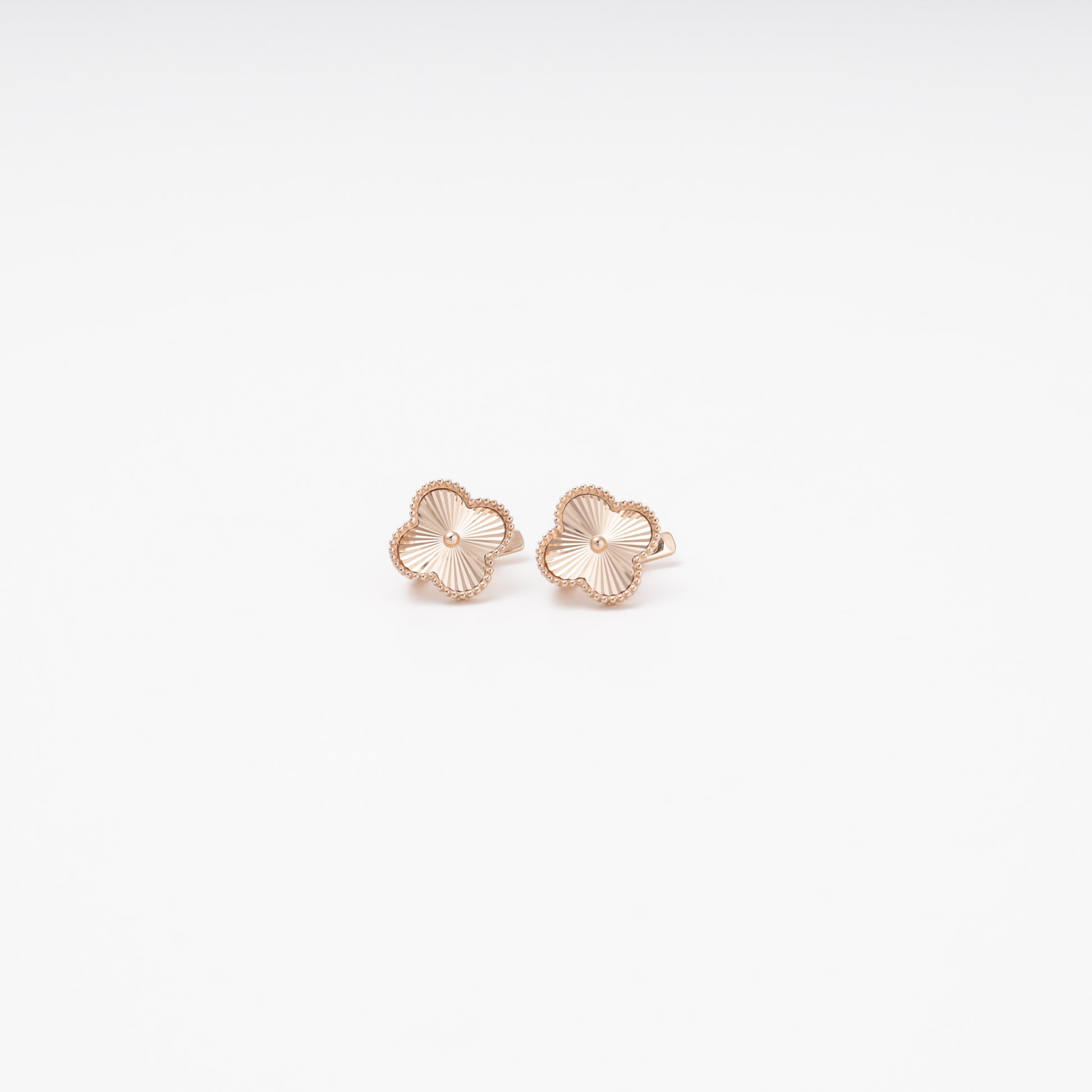 Rose gold 14K clover earrings with diamond-cut texture, pair view — Kabluchka
