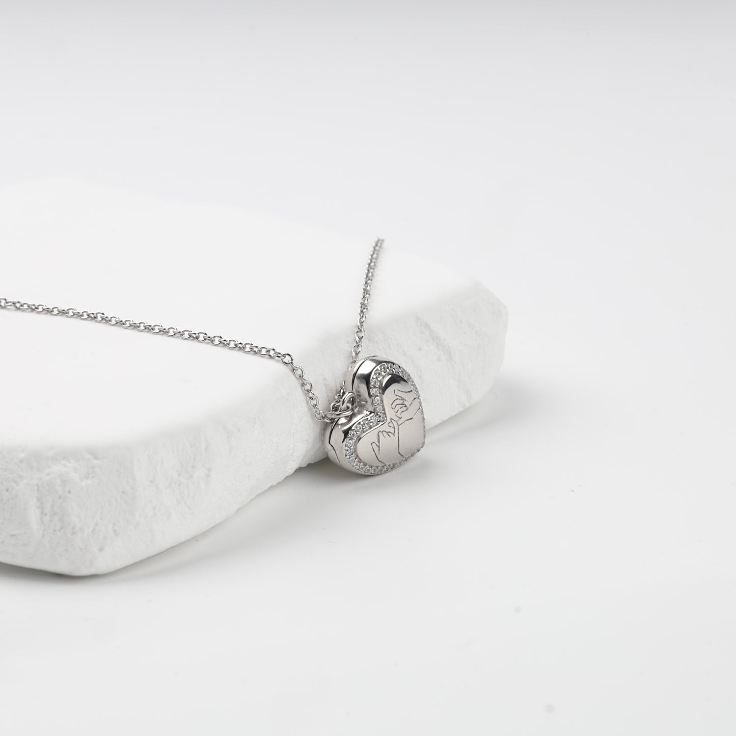 Pinky-promise engraving and cubic zirconia heart outline