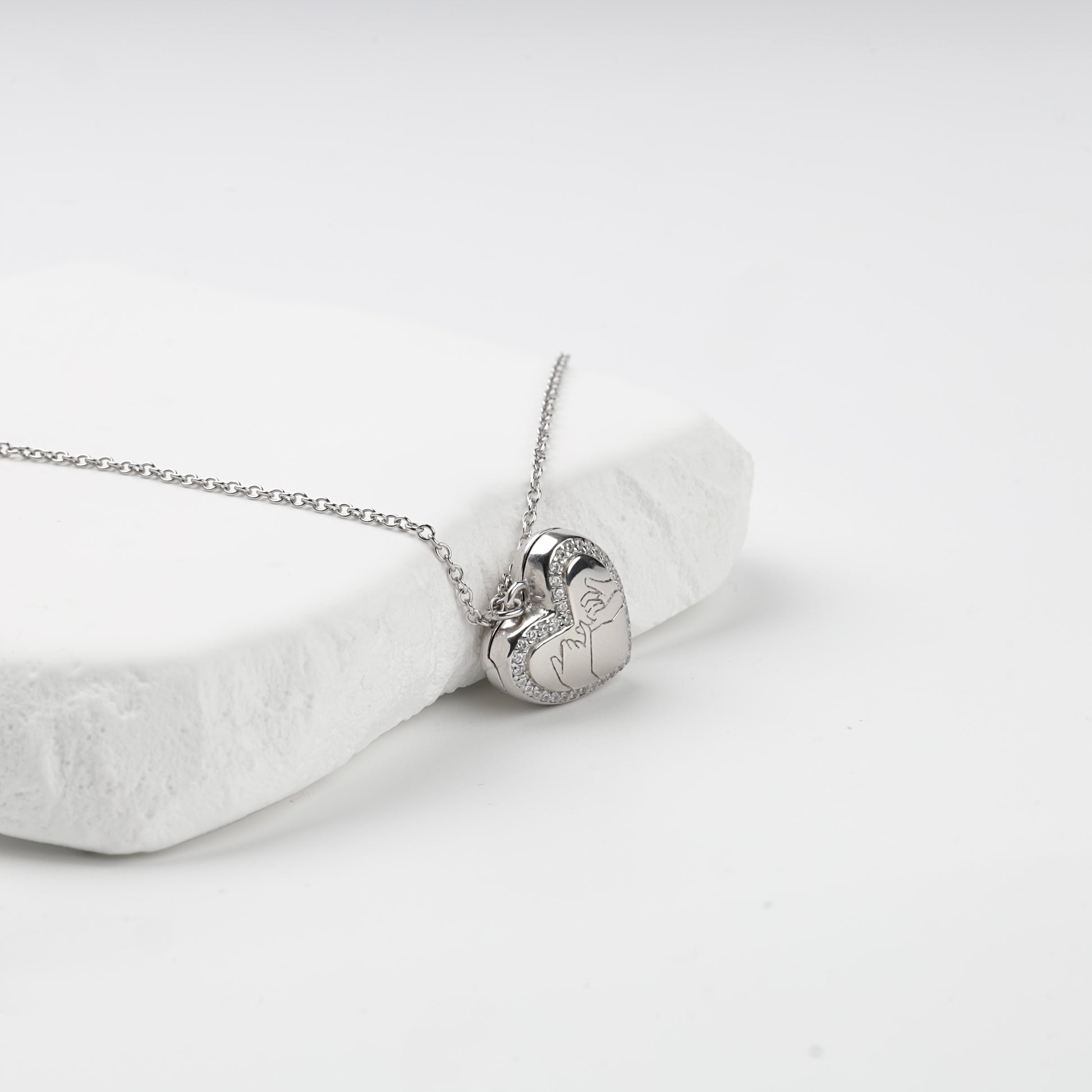 Pinky-promise engraving and cubic zirconia heart outline