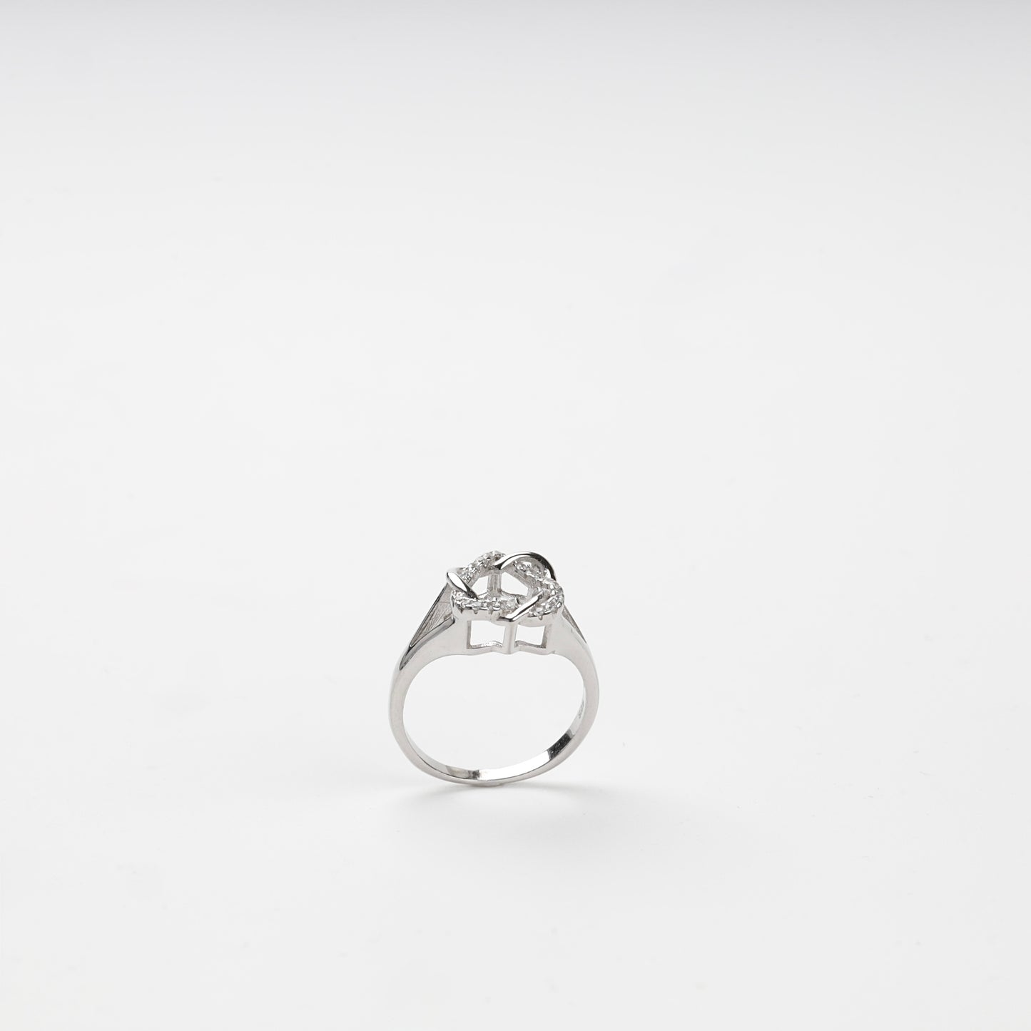Back view of the polished ring shank and geometric openwork setting