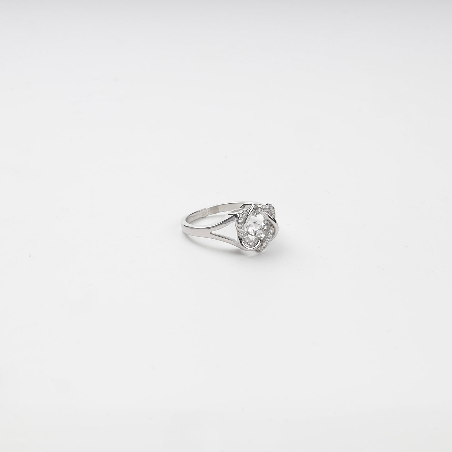 Side view of a Silver 925 ring with openwork arcs and a suspended center stone