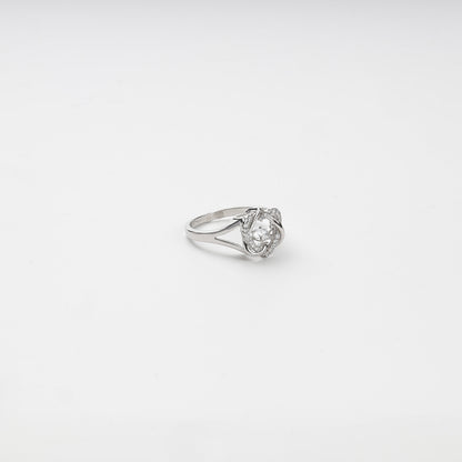 Side view of a Silver 925 ring with openwork arcs and a suspended center stone