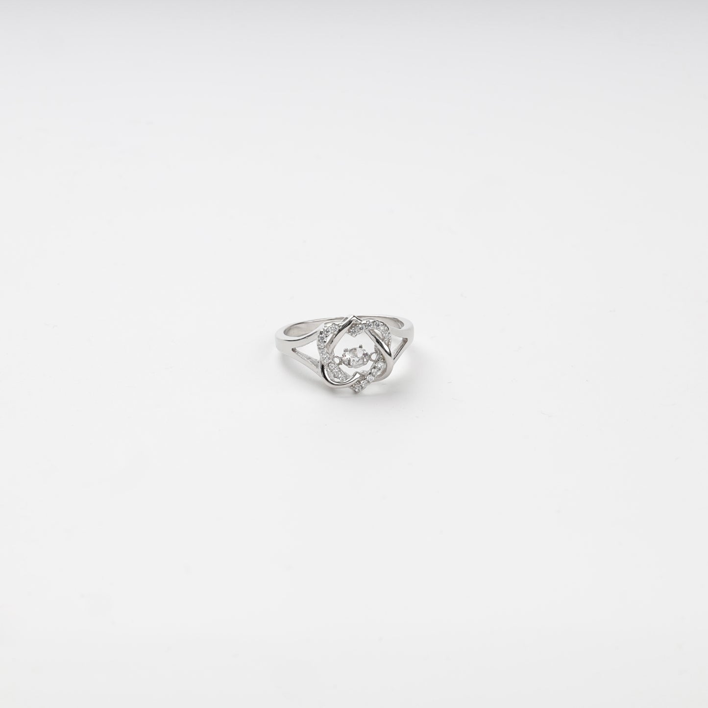 Silver 925 cubic zirconia ring with a moving center stone on a white background