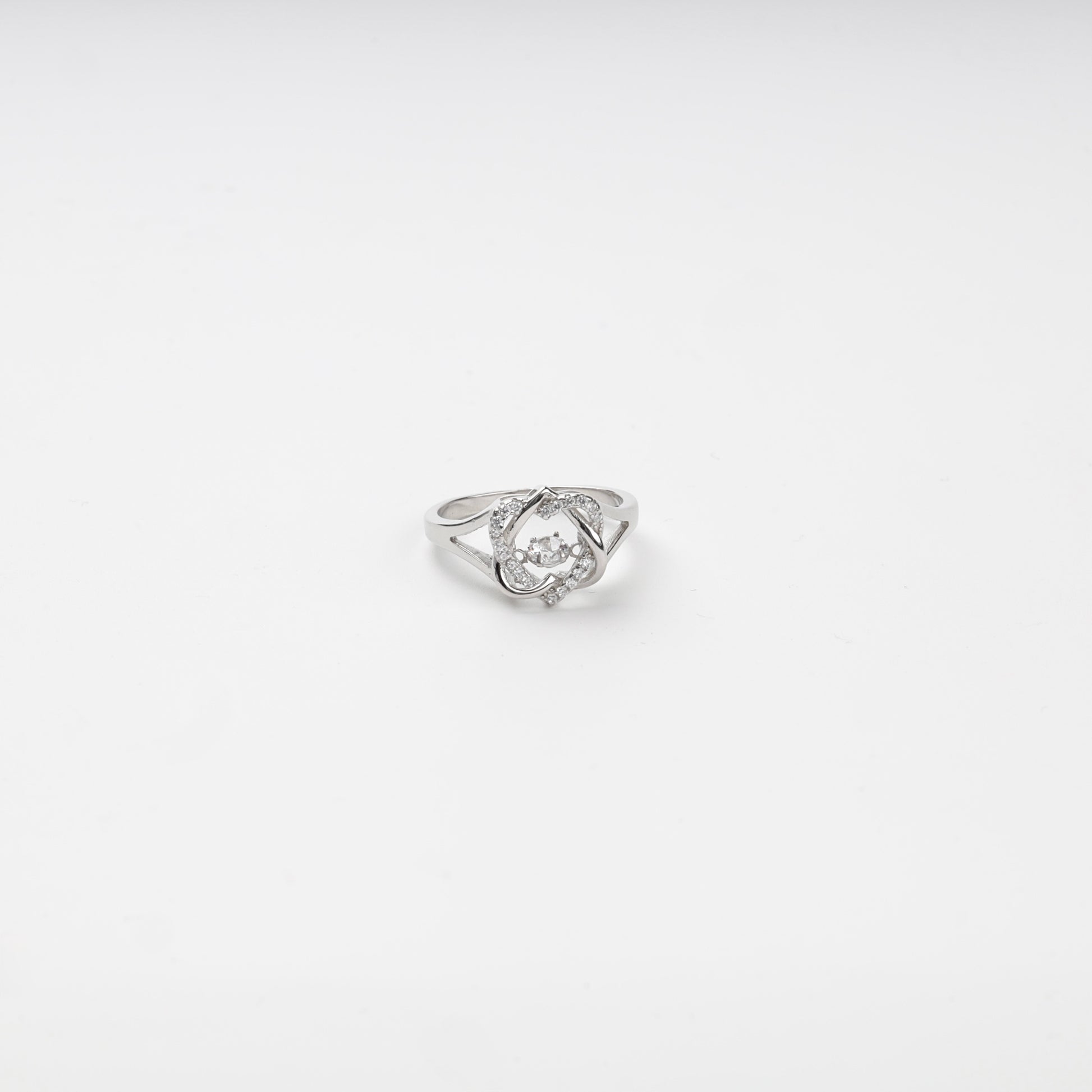 Silver 925 cubic zirconia ring with a moving center stone on a white background