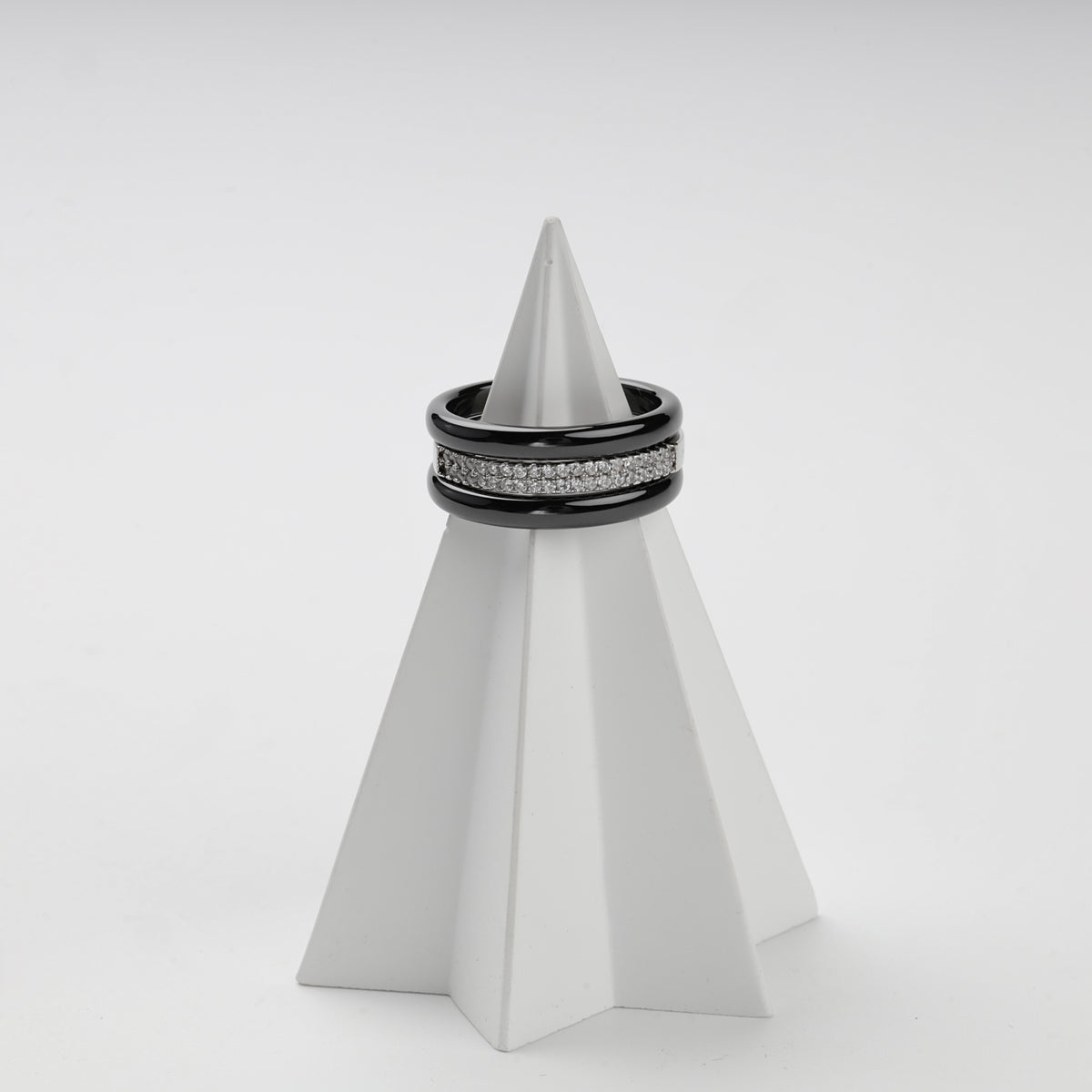 Black ceramic and cubic zirconia ring set shown in an alternate stacked arrangement