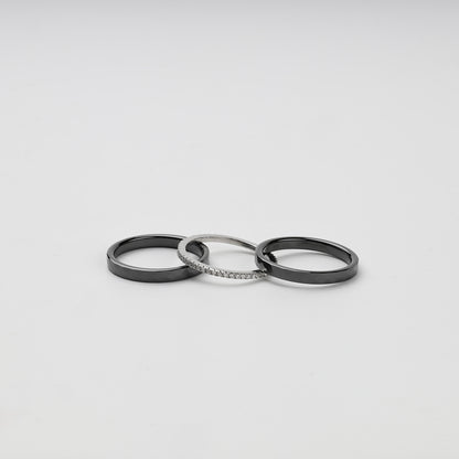 Three separate faceted black ceramic and Silver 925 cubic zirconia rings