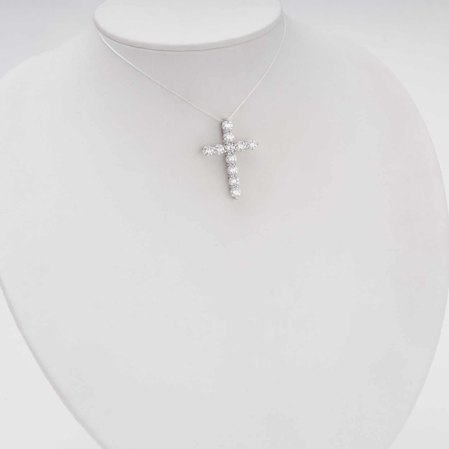 Diamond cross pendant 14K white gold on bust display - Kabluchka jewelry