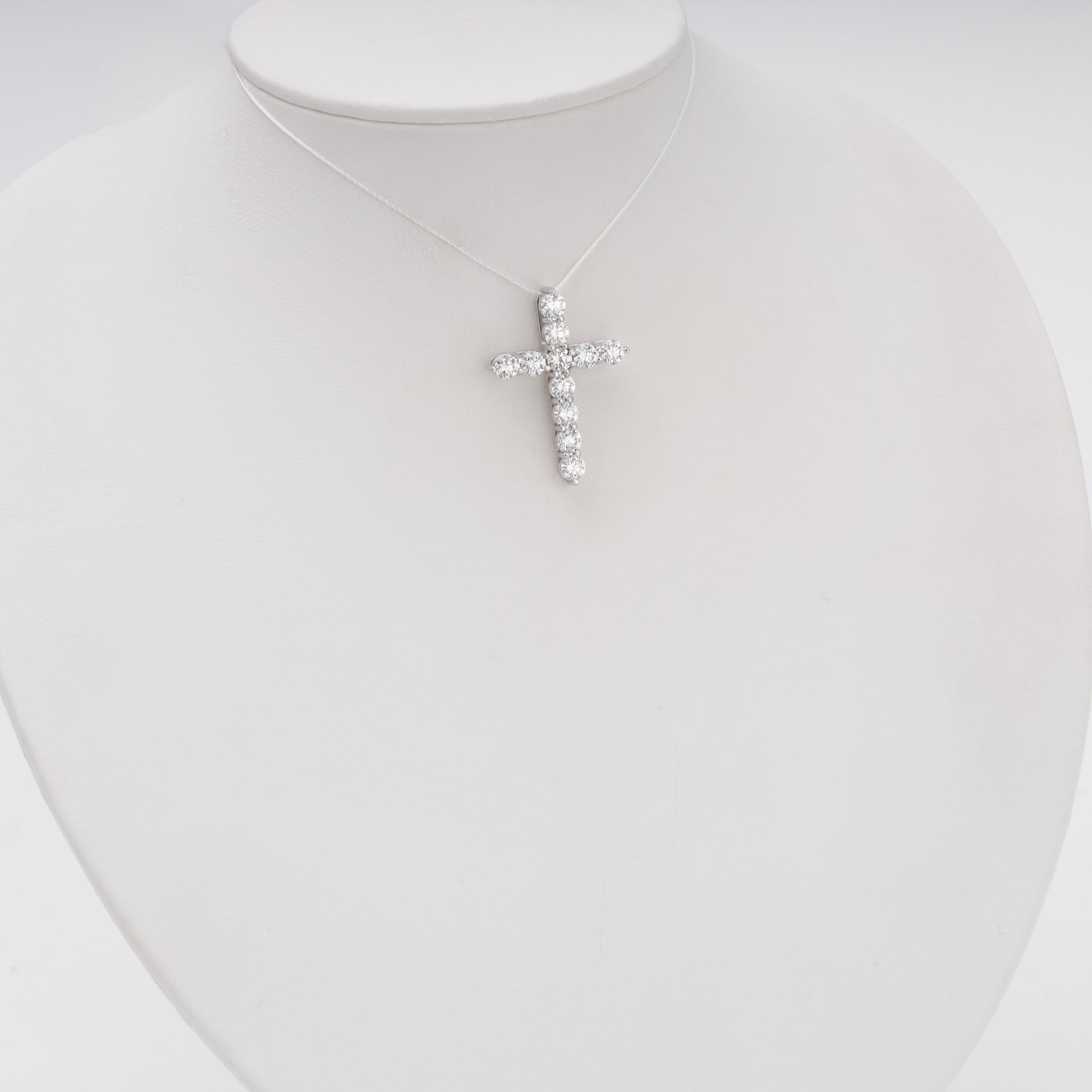 Diamond cross pendant 14K white gold on bust display - Kabluchka jewelry