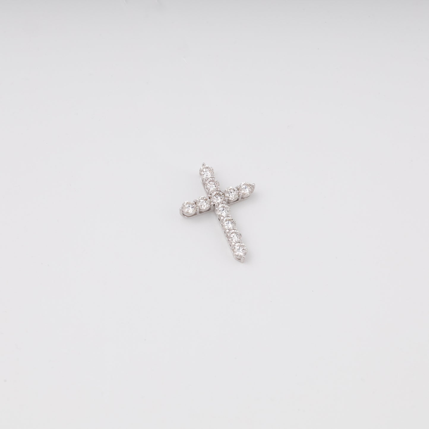 White gold diamond cross pendant flat lay top view showing 11 stones - Kabluchka