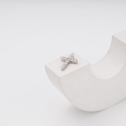 14K white gold cross pendant on curved prop showing side profile - Kabluchka