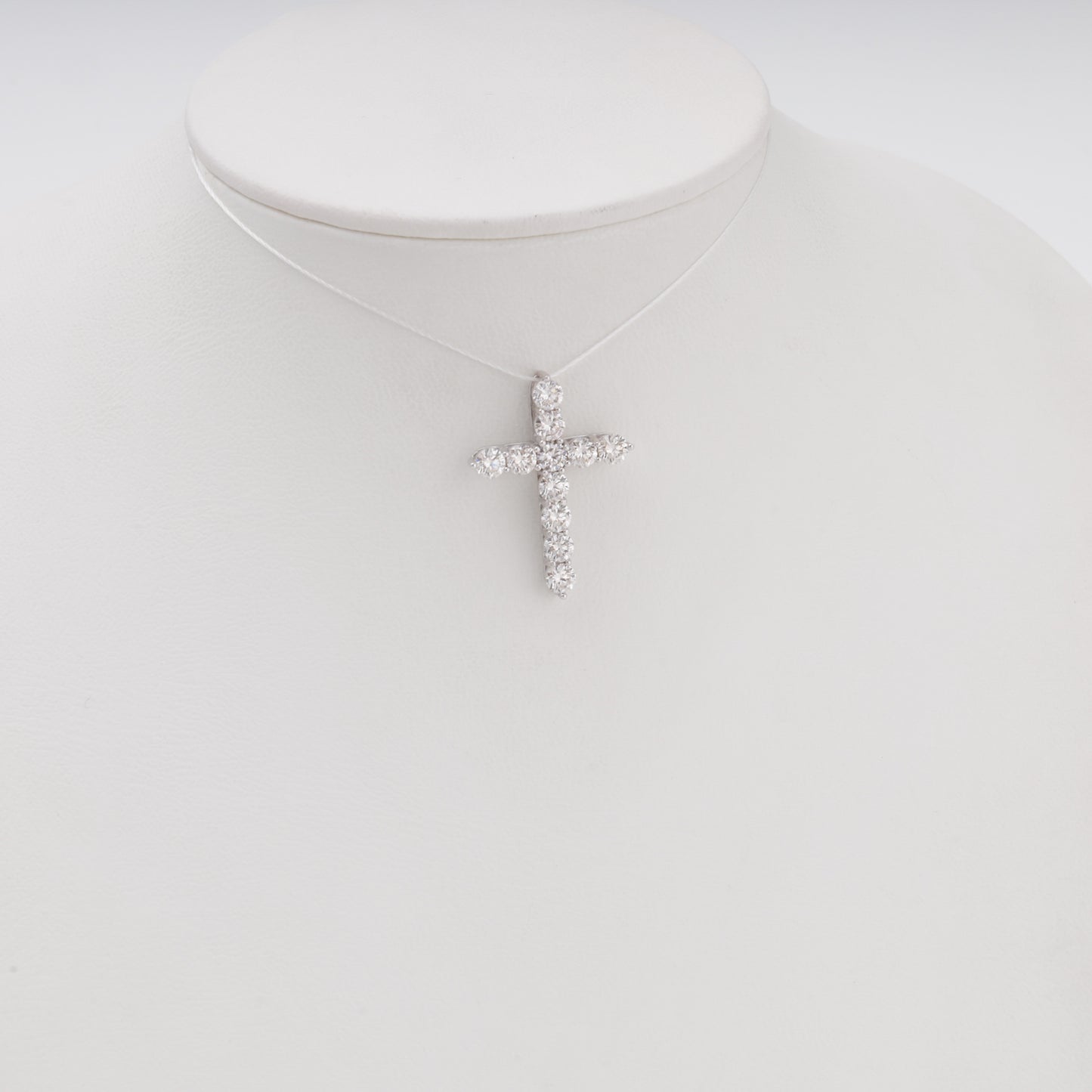 Diamond cross pendant 14K white gold on bust display front view - Kabluchka jewelry