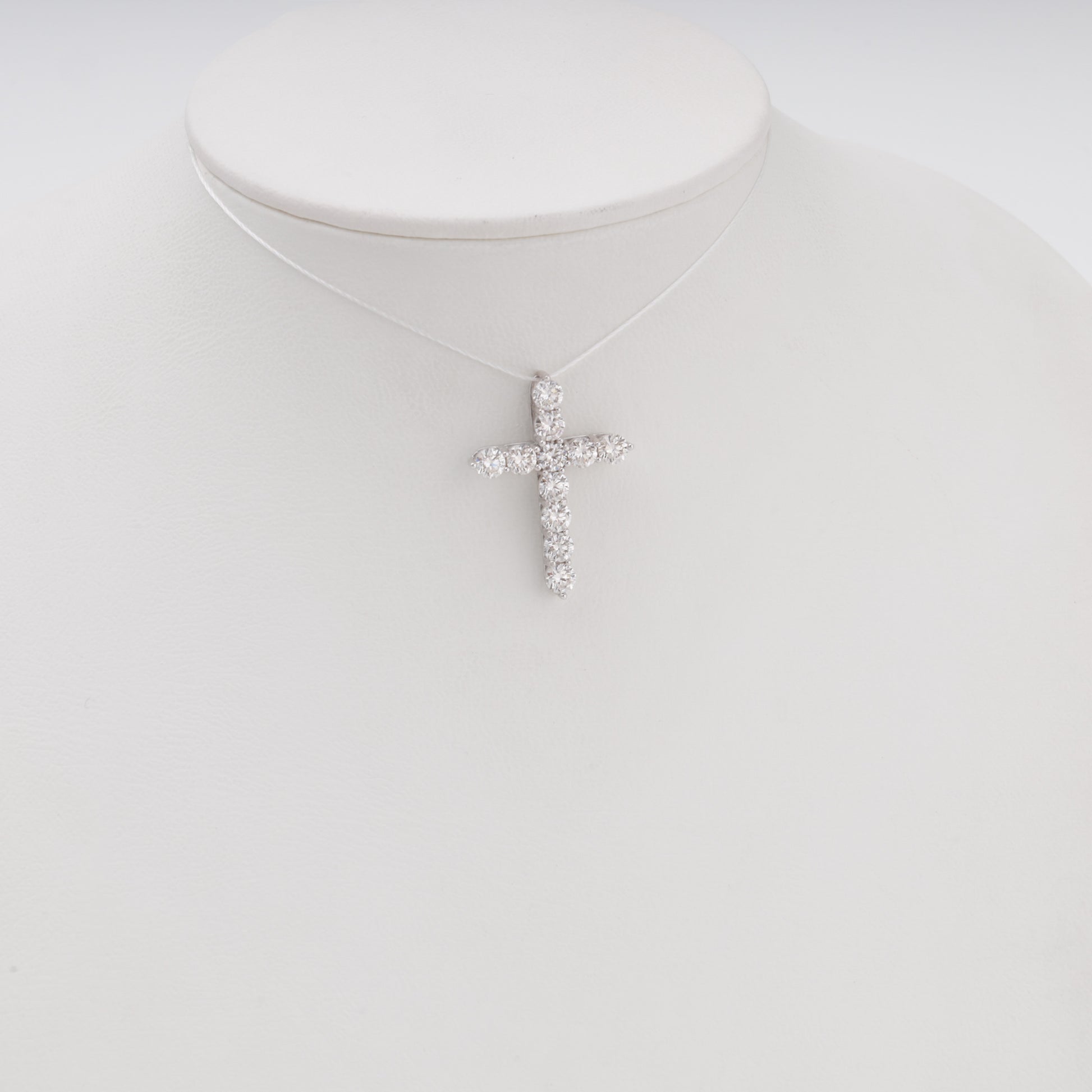 Diamond cross pendant 14K white gold on bust display front view - Kabluchka jewelry