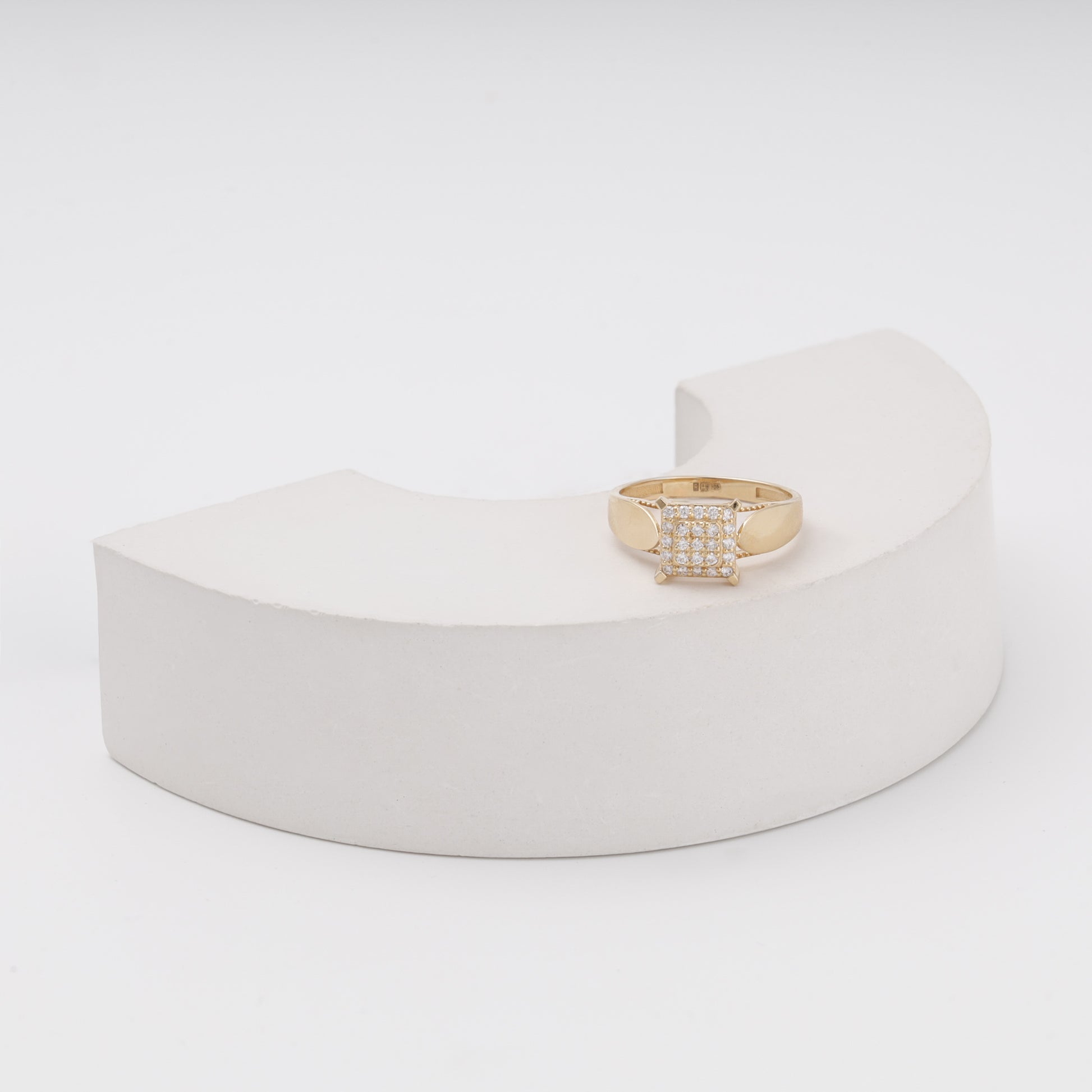 Yellow gold pave ring with milgrain border on display - Kabluchka