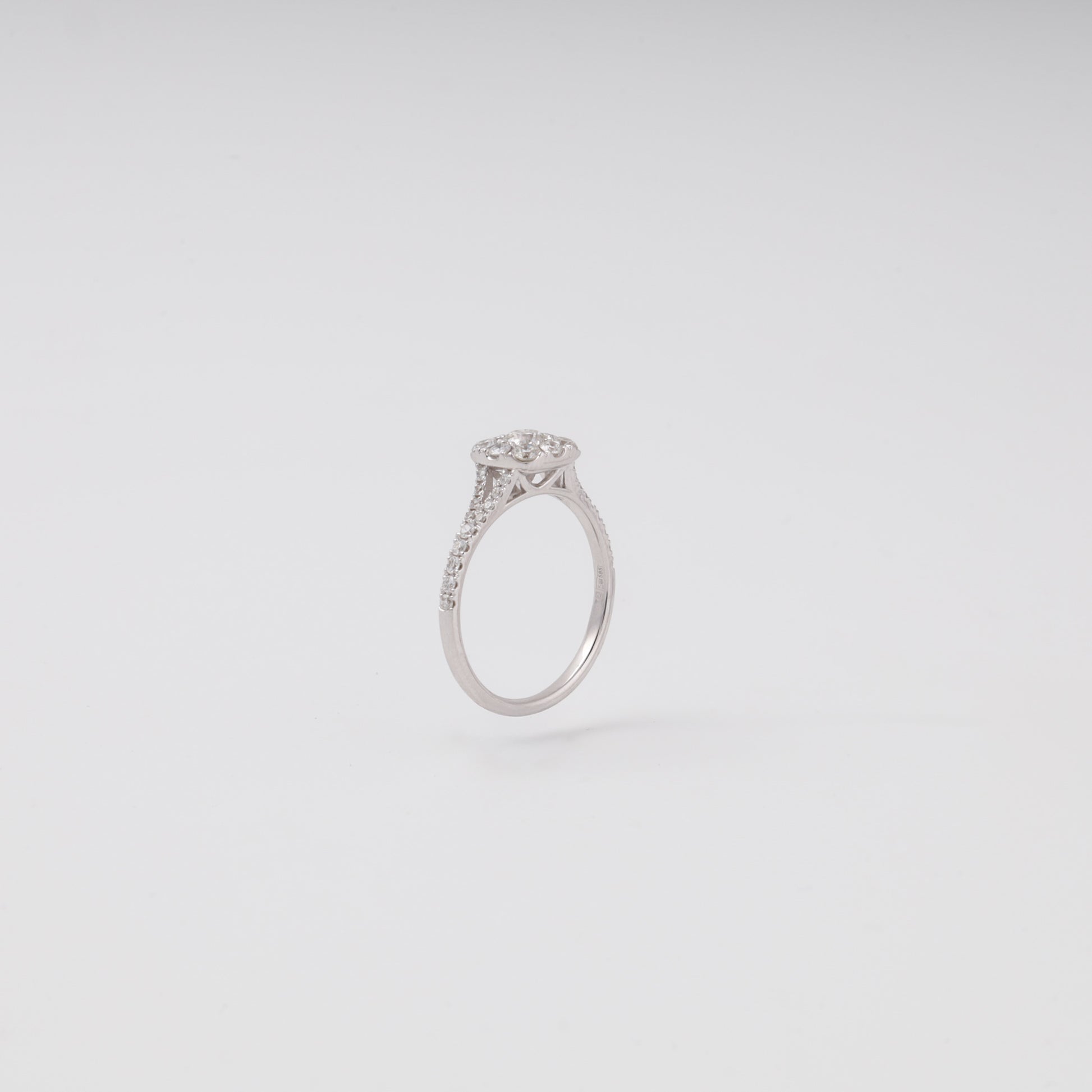 Diamond cluster ring side profile showing pave split shank - Kabluchka