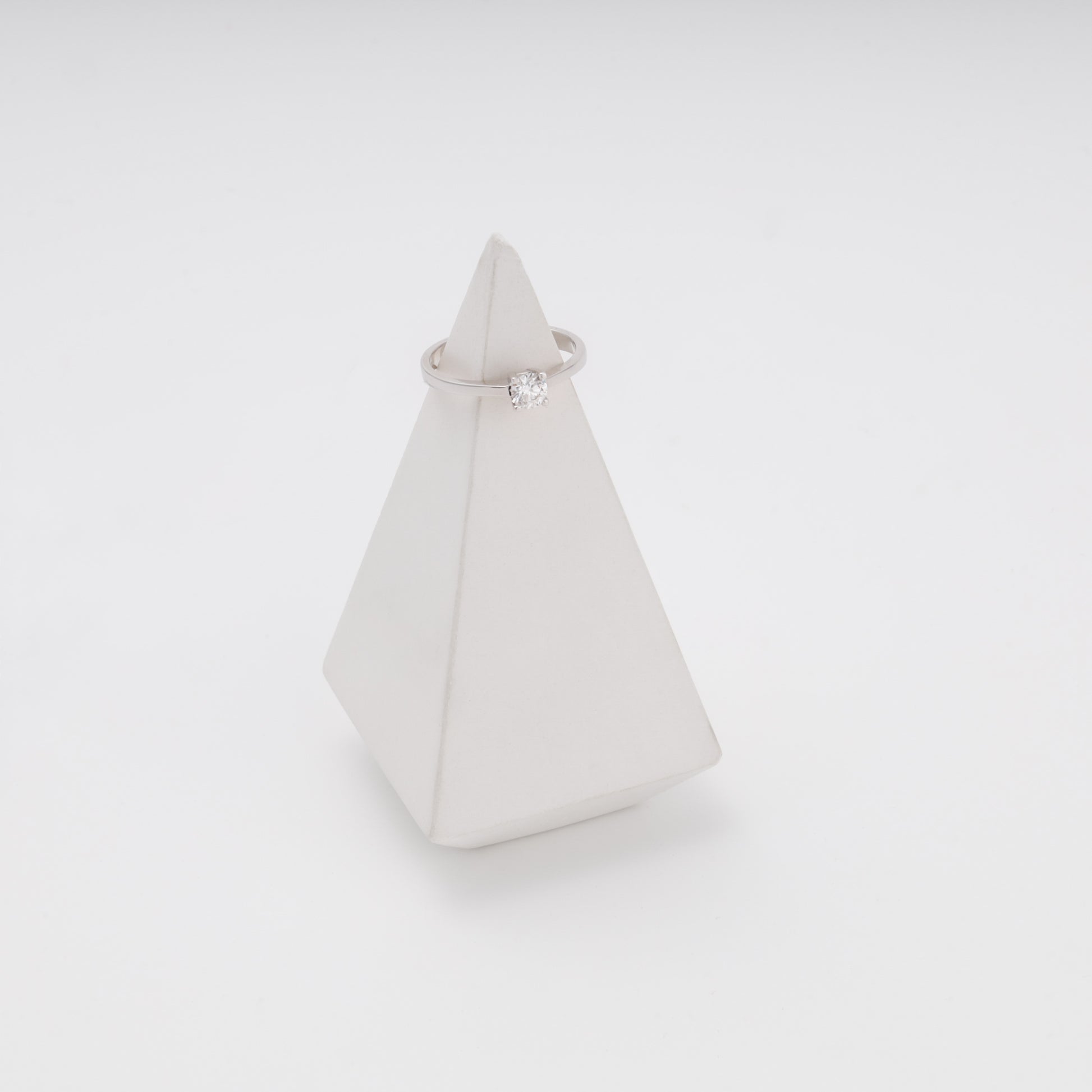 14K white gold engagement ring on pyramid display prop - Kabluchka jewelry