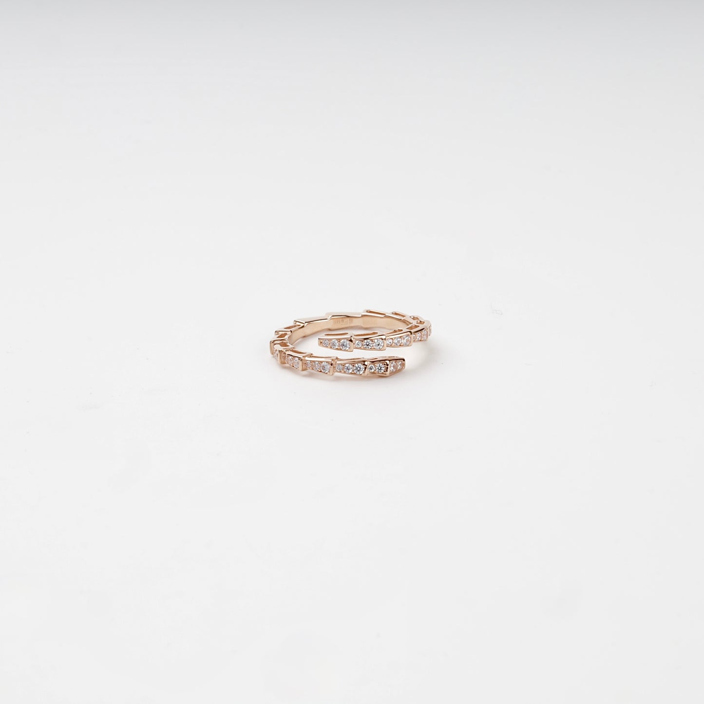 Cubic zirconia segmented wrap ring, angled view — Kabluchka